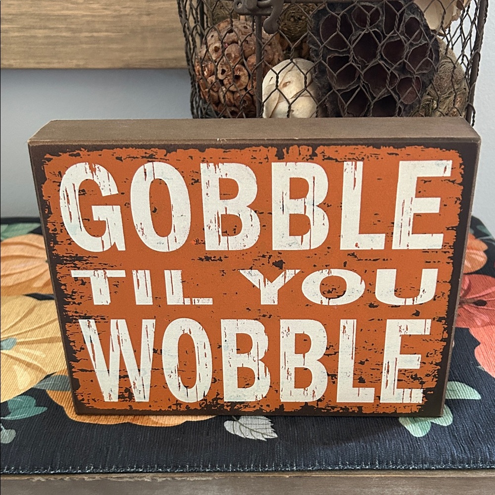 Orange 'Gobble Til You Wobble' Sign
